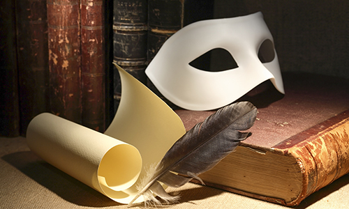Dramaturgy Concept Dramaturgy concept. Vintage still life with quill and scroll near mask and old books on dark background